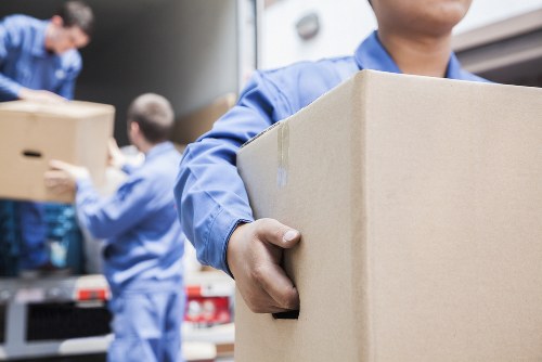 Student removal team preparing boxes and furniture in a Ruislip property