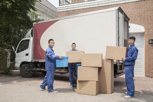 Team member carrying out a careful property move with protection gear