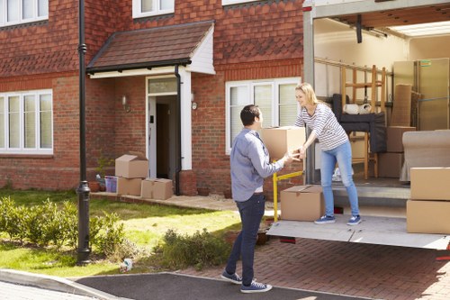Man with van loading furniture for a local move in Ruislip