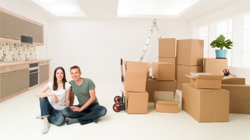 Professional movers preparing large furniture for safe transport