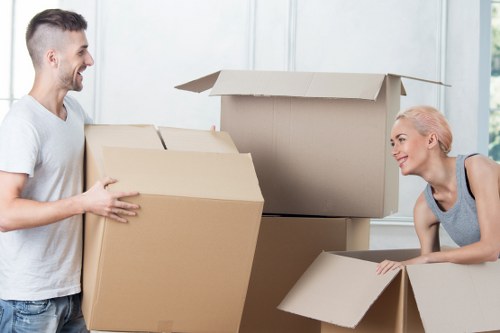 Careful handling of furniture through a shared hallway in Ruislip